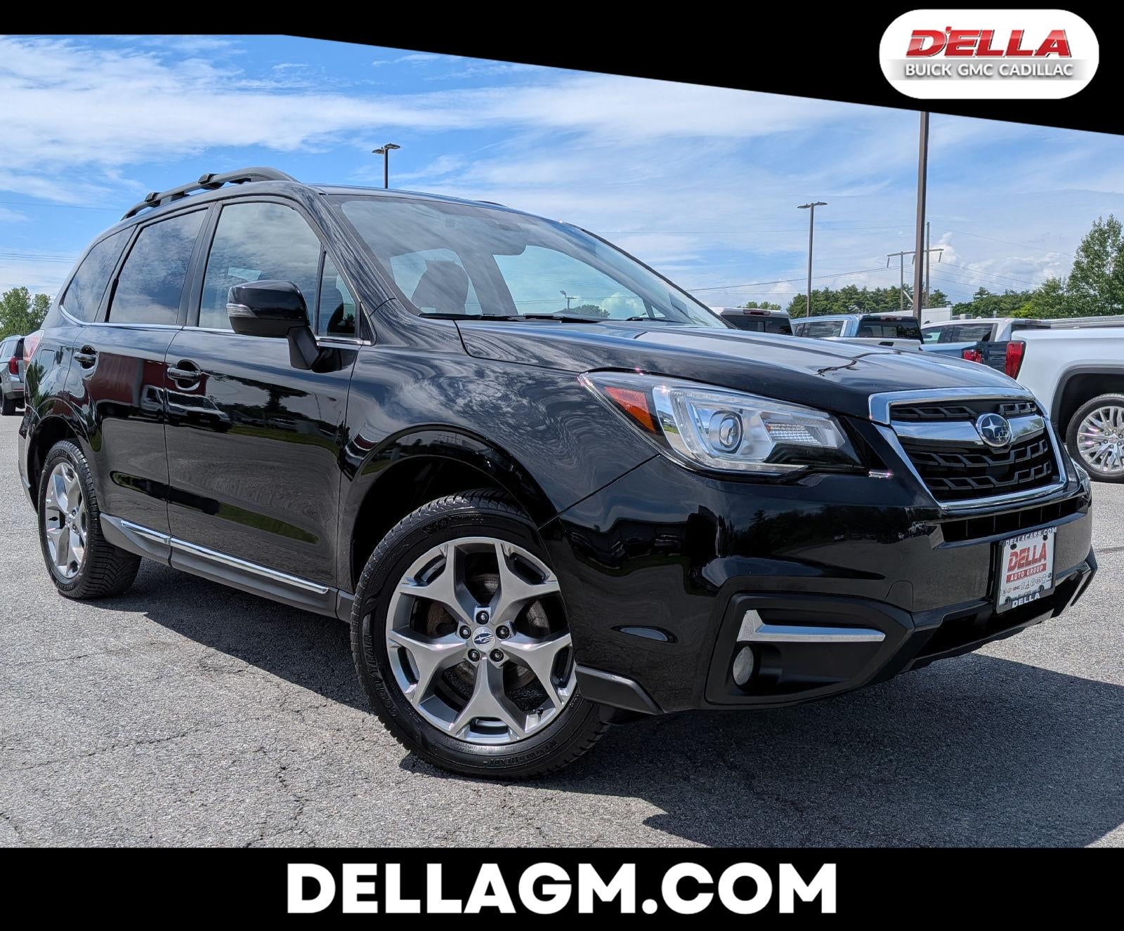 2018 Subaru Forester Touring in Crystal Black S — front three-quarter view