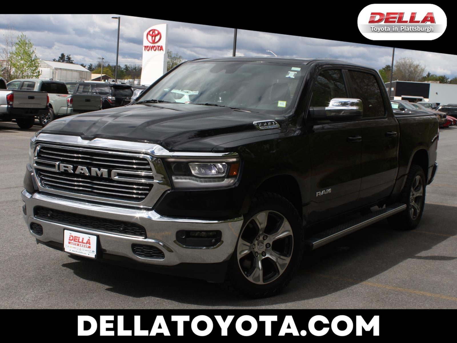 2023 RAM 1500 Laramie in Diamond Black Crystal Pearlcoat — front three-quarter view
