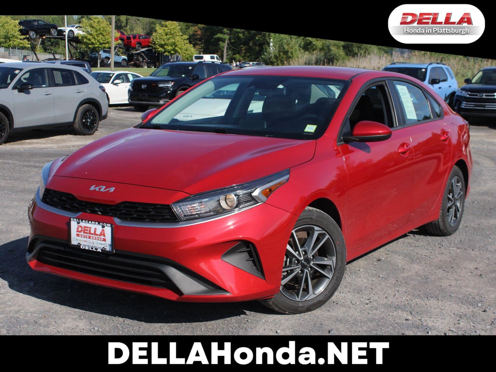 2024 Kia Forte LX in Currant Red — front three-quarter view