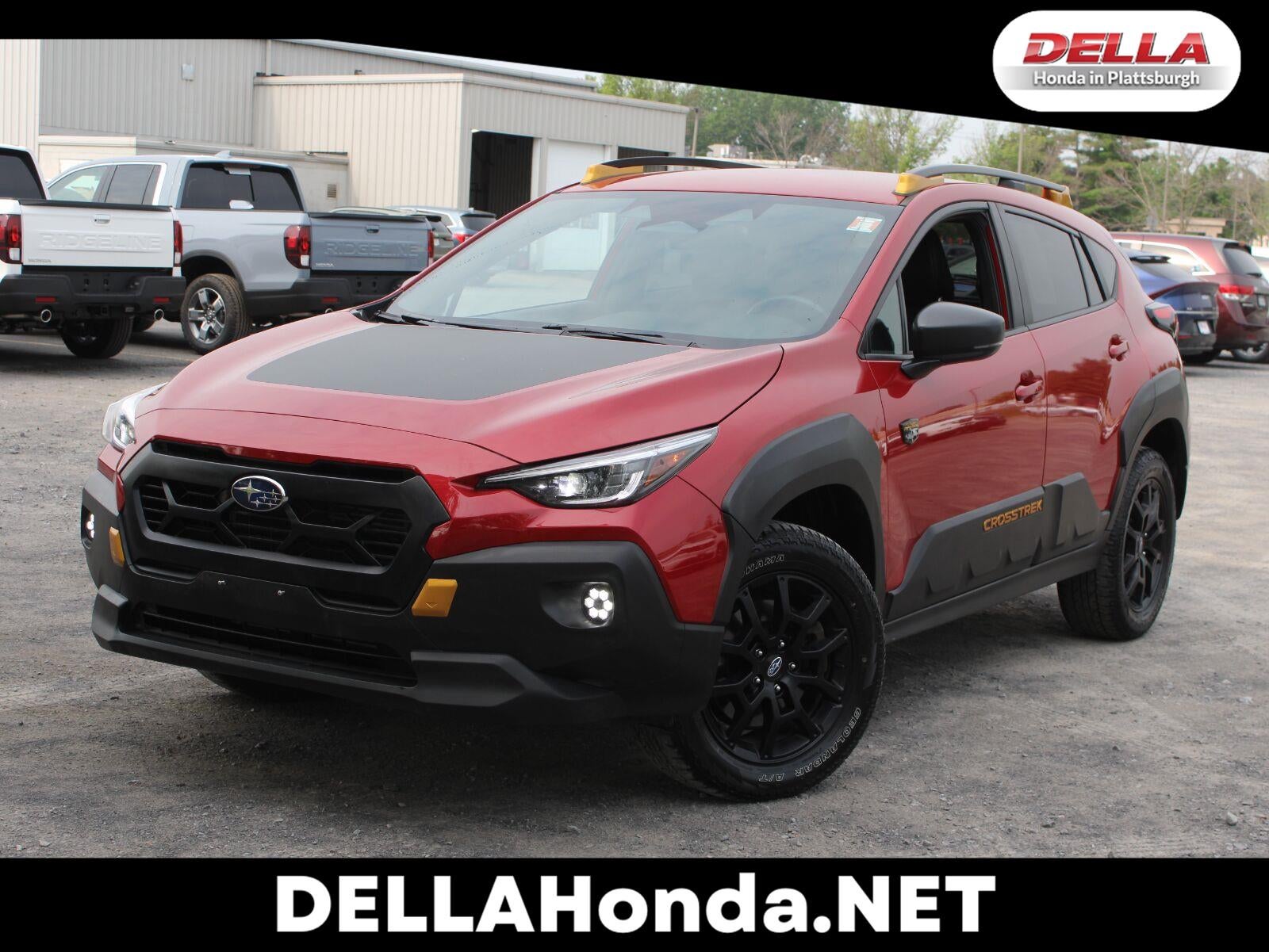 2024 Subaru Crosstrek Wilderness All Wheel Drive CVT in Lithium Red Pearl — front three-quarter view