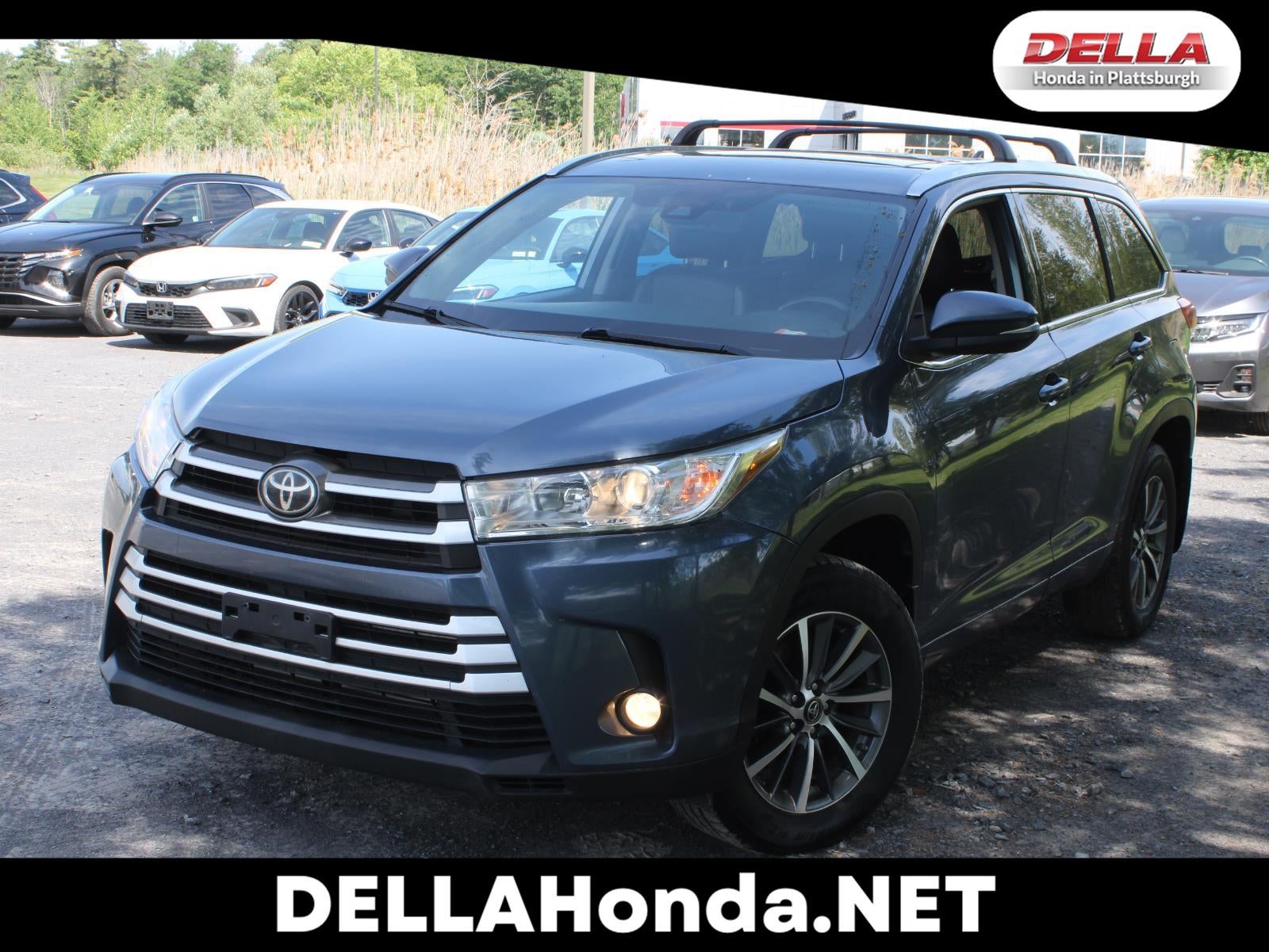 2018 Toyota Highlander LE in Shoreline Blue Pearl — front three-quarter view
