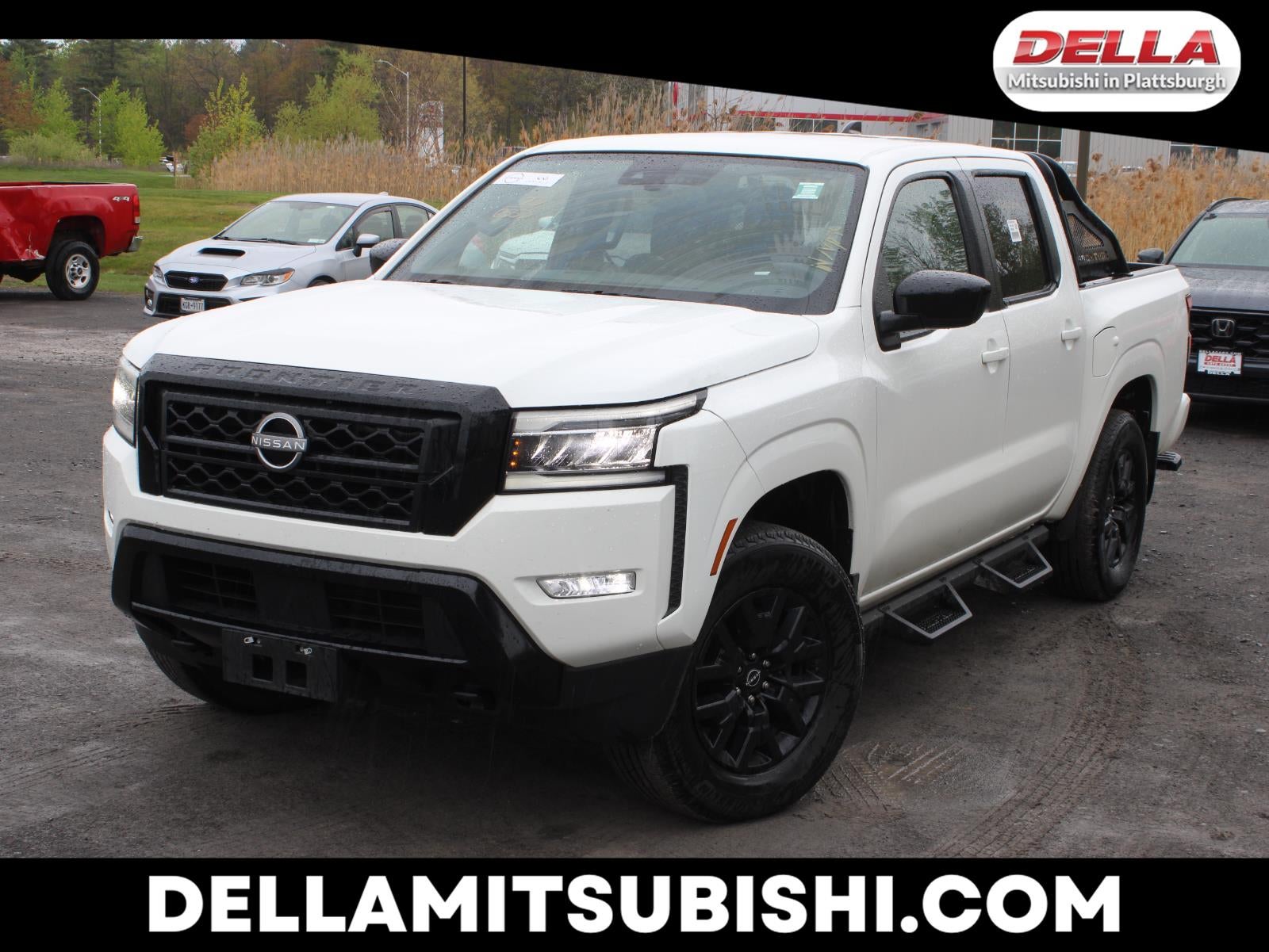 2023 Nissan Frontier SV in Glacier White — front three-quarter view
