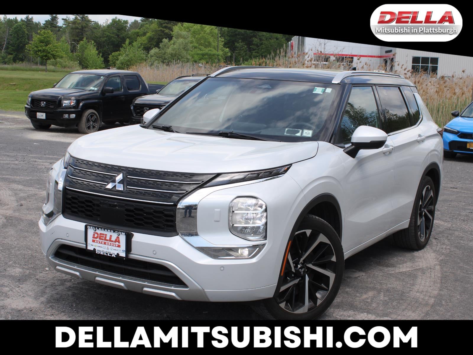 2024 Mitsubishi Outlander SEL in White — front three-quarter view