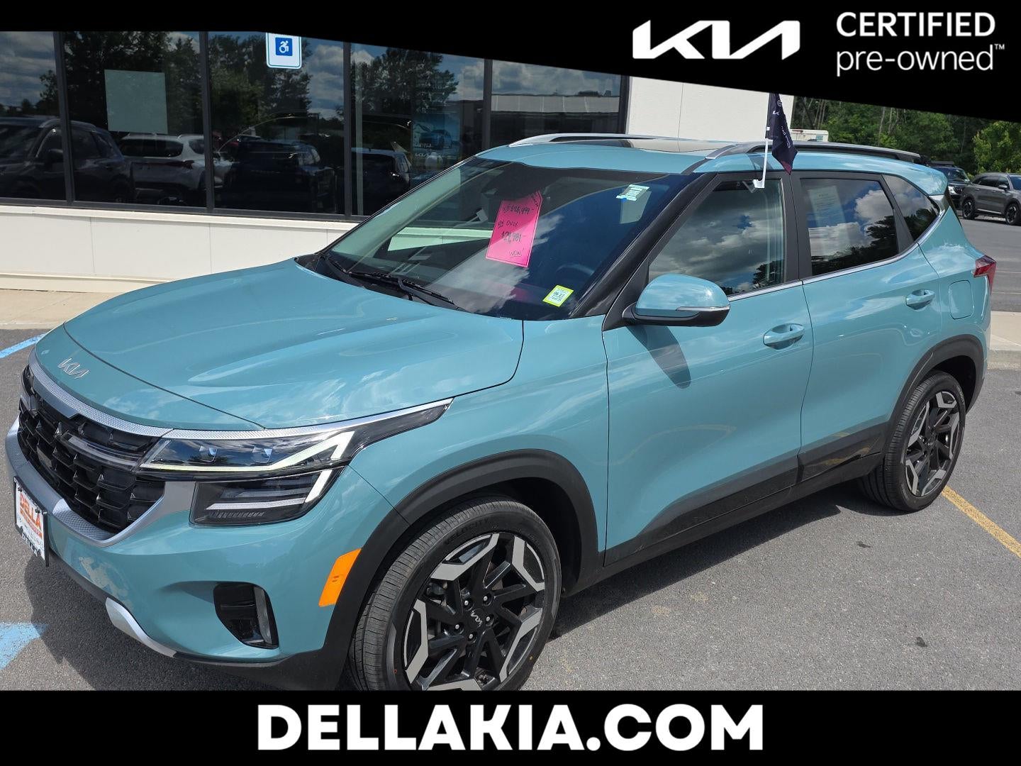 2024 Kia Seltos SX in Pluton Blue — front three-quarter view