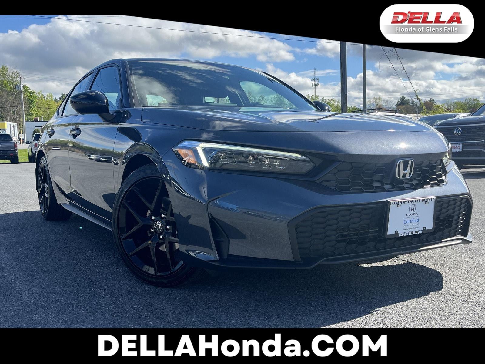 2026 Honda Civic Hatchback Sport in Meteorite Gray Metallic — front three-quarter view