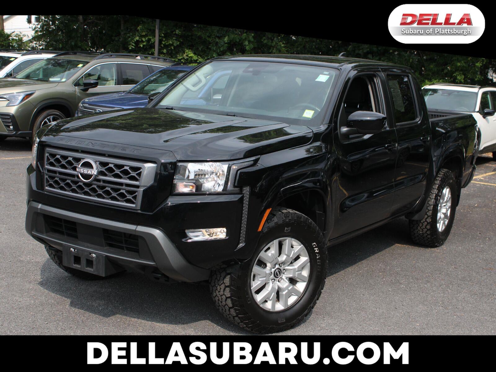 2024 Nissan Frontier SV in Super Black — front three-quarter view