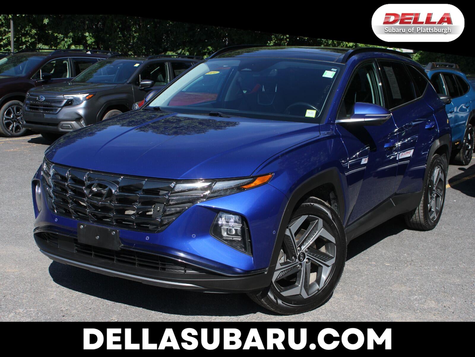 2024 Hyundai Tucson Limited in Intense Blue — front three-quarter view