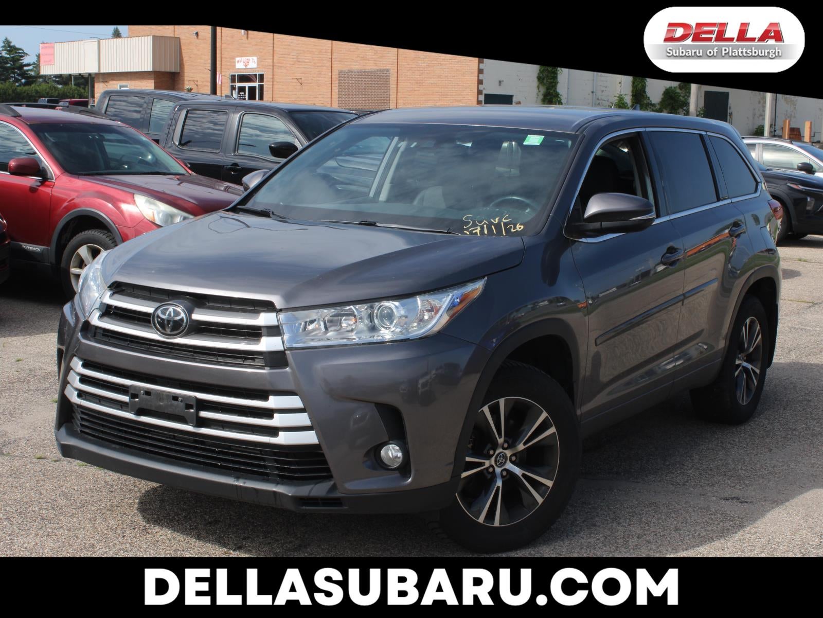 2018 Toyota Highlander LE Plus in Predawn Gray Mica — front three-quarter view