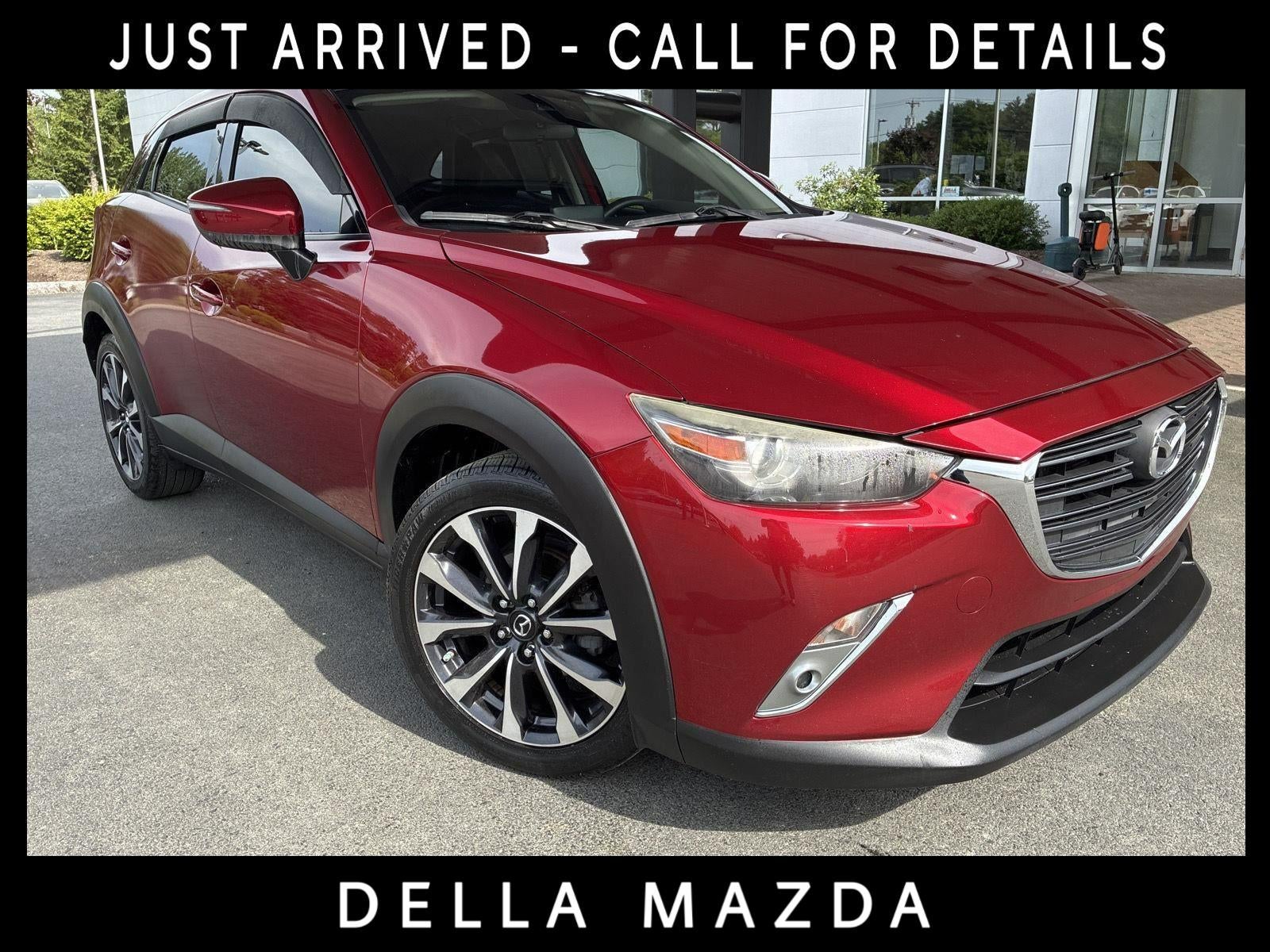 2019 Mazda Mazda CX-3 Touring in Soul Red Crystal Metallic — front three-quarter view