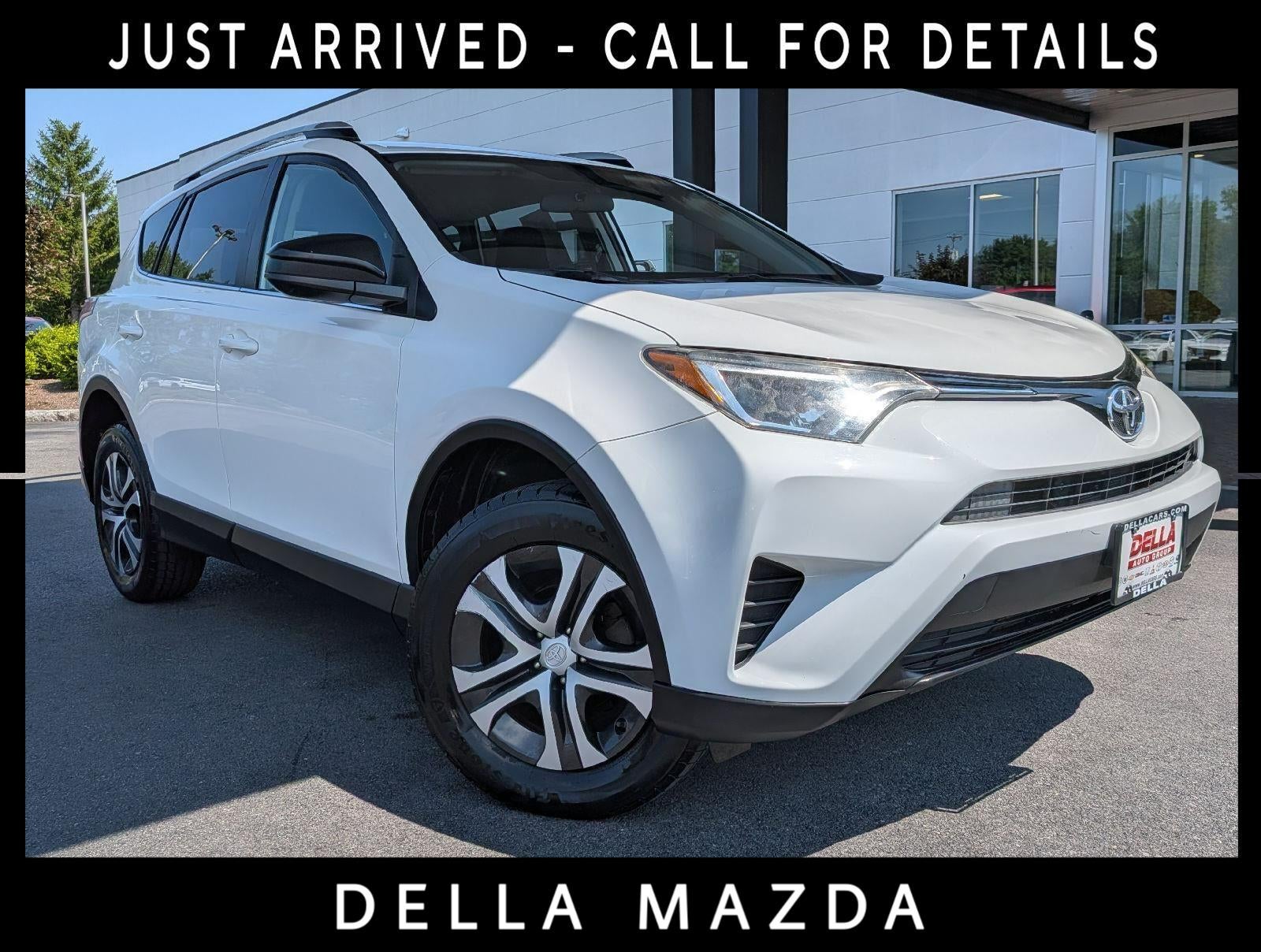 2016 Toyota RAV4 LE in Super White — front three-quarter view