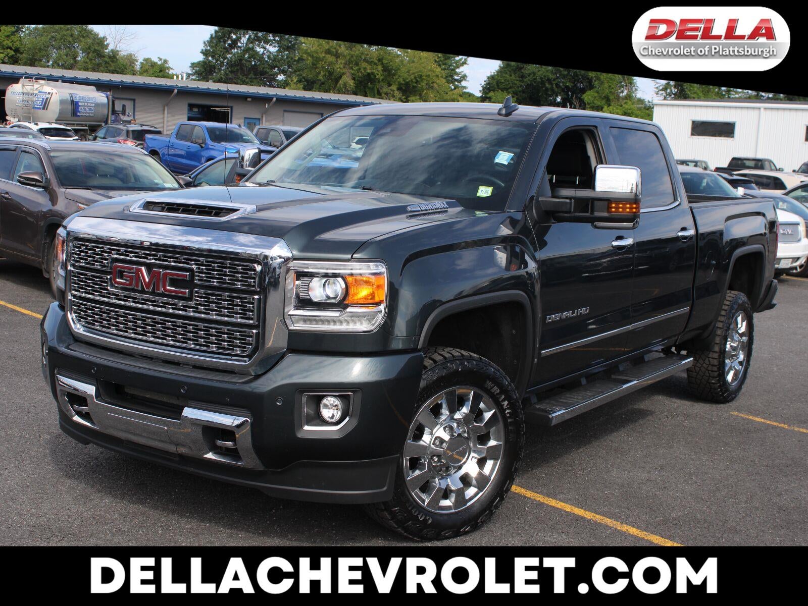2019 GMC Sierra 2500 HD Denali in Dark Slate Metallic — front three-quarter view